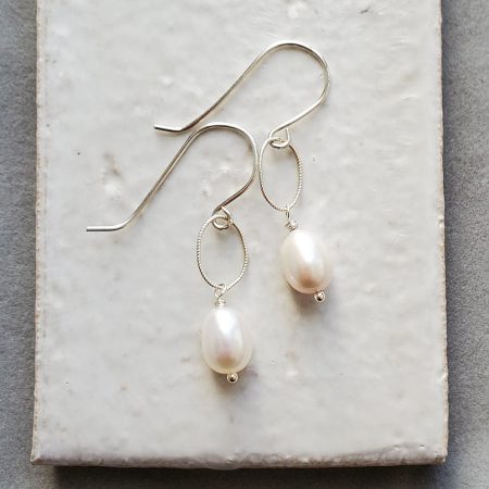 Oval pearl and silver earrings handmade by Carrie Whelan Designs