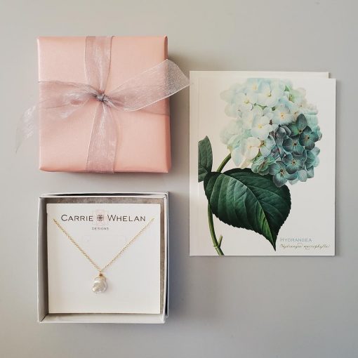 Gift wrap and hydrangea note card with jewelry from Carrie Whelan Designs