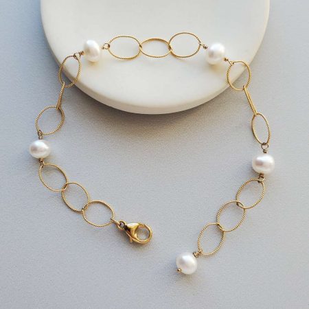 Gold chain and pearl bracelet by Carrie Whelan Designs